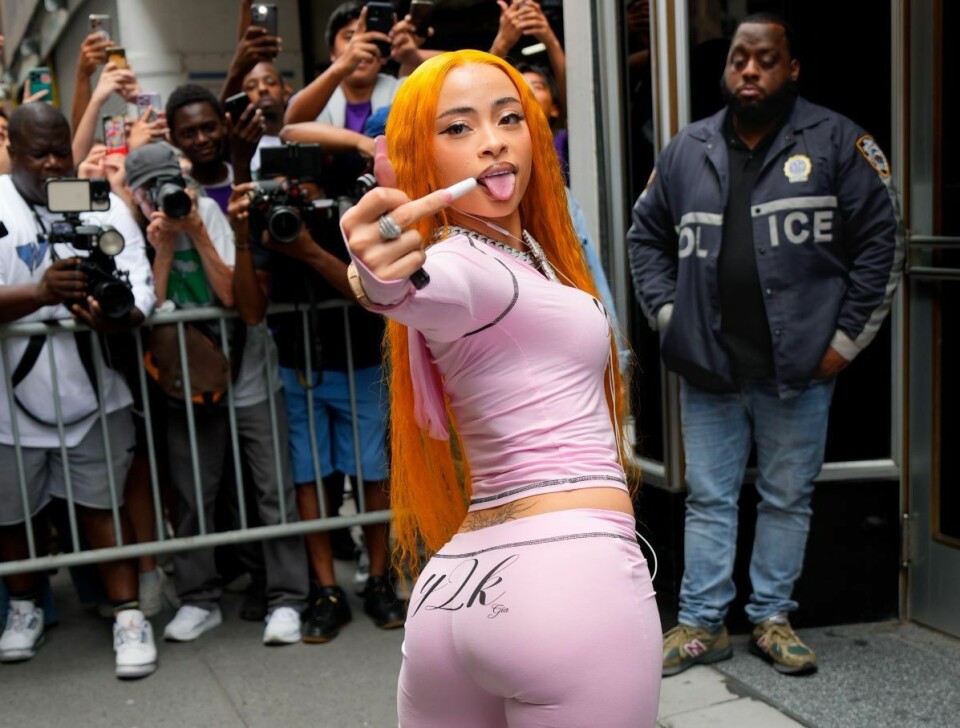 
Ice Spice in pink Y2K outfit posing for fans and photographers in New York City
