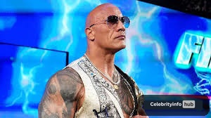 Dwayne "The Rock" Johnson net worth 2026 in WWE SmackDown outfit

